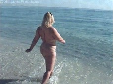 Perfect white woman on the beach, needs some black dick while on vacation gif