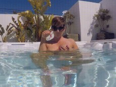 Hannah Brooks teasing tits and points under water in hot tub gif
