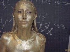 Oooops chemist accidently turns herself into a golden statue gif