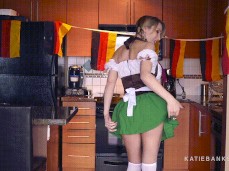 Katie Banks bends over and teasese in German costume gif