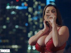 Sophie Dee sips champagne in her bra gif