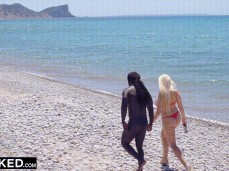 Angel Wicky walking on beach in thong bikini with naked  stud gif