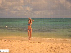Stacy Cruz dancing on beach in thong bikini gif