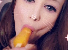 Cutie Pulls Popsicle Out Of Mouth and Giggles at Orange Teeth gif