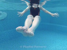 Girl in one piece swimsuit swimming and showing her feet gif