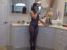 On phone in bodystocking p1 gif