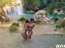 Two girls skinny dipping and making out at waterfall gif