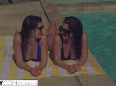 Leah Gotti and Keisha Grey chatting while sunbathing poolside gif