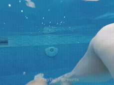 POV of girl's legs swimming in public pool gif