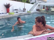 Guy joins naked Tori  on the far side of the pool gif