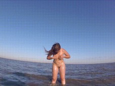 Cute  pours water over her great body in the sea gif