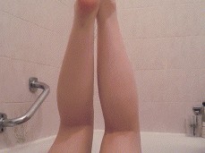 MILF Playing with Legs up Touching herself in the Bath gif