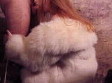 Redhead Babe in White Fox Fur Sucks Deep gif