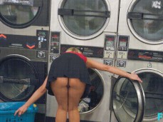 Katie Morgan in short skirt loading washing machine gif
