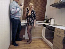 Kate Truu in open robe and stockings toasting in kitchen during xmas party` gif