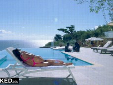 Ariana Marie on phone poolside in thong bikini watching two  studs gif