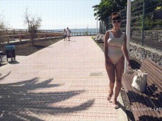 Naughty Lada on the boardwalk in sheer white swimsuit 01 gif