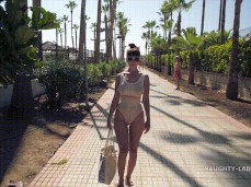 Naughty Lada on the boardwalk in sheer white swimsuit 01 gif