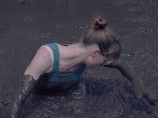 Cutie wallowing in thick mud gif