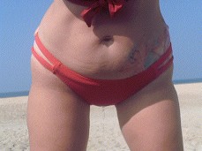 Pissing in red bikini