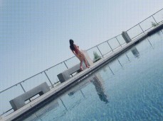 Angela White thong swimsuit by the pool gif