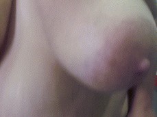 chubby girl teasing with her huge wobbly boobs gif
