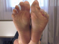 Miss Honey controls your cock with her nylon soles gif