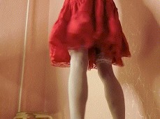 Masked TS in red dress and vynil red shoes gif