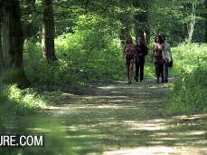 Anissa Kate and friend topless in thongs marching through the forest gif
