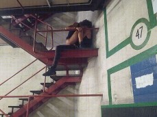 couple having  sex in parking garage stairs gif