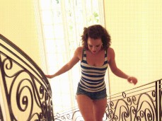 Katie St Ives running in tight clothes running up the stairs gif