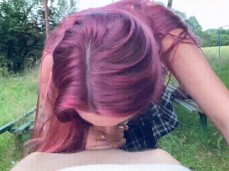 Cute redhead schoolgirl gives outstanding blowjob in the park gif