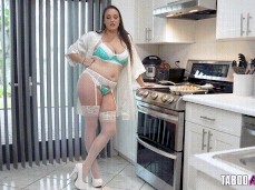 Melanie Hicks at the stove in robe and lingerie gif