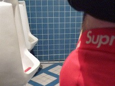 johnholmesjunior pulling his soft cock at open mens bathroom in vancouver gif