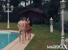 Mariska X walking two guys naked to far side of pool gif