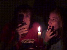 Smoking couple next to candle gif