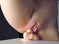 Perfect Puffy Pussy Riding Thick Dildo On Table gif