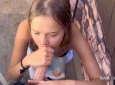 Petite tiny  Coco Lovecock sucking cock on her knees in public gif