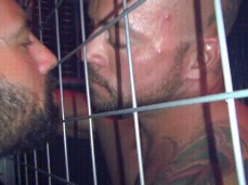 Two horny guys jacking off together, and kissing through a fence 0606 gif