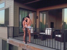 Topless JollaPR making out on balcony of vacation rental gif