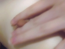 Brunette licks fingers and caresses protruding nipples gif