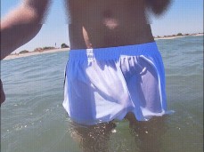 Sexy big dick feels free in transparent short shorts wetting at the beach gif