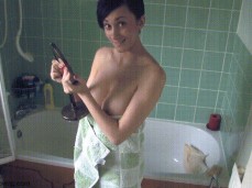 Busty girl's towel slips before shower