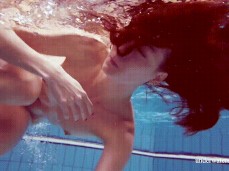 Nude woman swimming in a pool gif