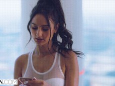 Eliza Ibarra Receives A Text Message And Looks At Her Phone gif