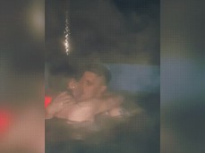 married couple getting naughty in hot tub gif
