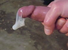 A proud bator shows off his tasty cum filled condom 2 gif