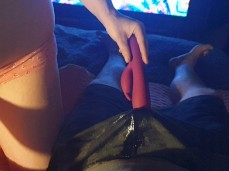 guy pees himself while his girlfriend teases him with a vibrator gif