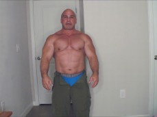 mature, bald muscle god Tony Dinozzo shows his huge pecs 0507-1 gif
