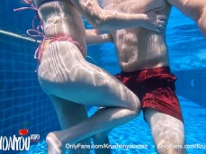 Touching her butt in the swimming pool, followed by ballbusting knees gif